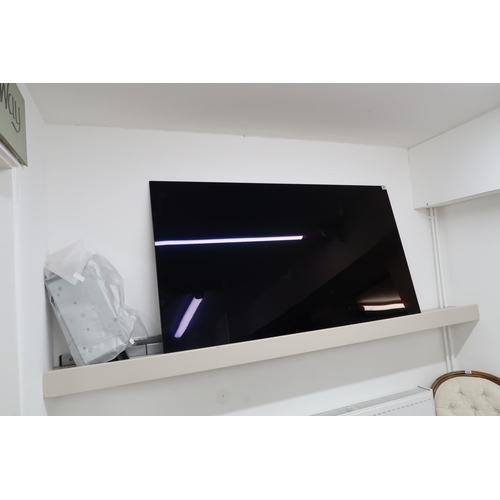 693 - An LG 65'' flat screen T.V. with wall mounting bracket and stand. Model No.OLED65C14LB. Serial Numbe... 