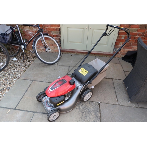 701 - A Honda petrol lawnmower - model GCVX 145 - runs but needs a service