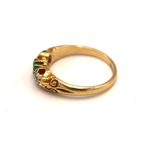 101 - An 9ct yellow gold (tested) diamond and green stone ring, size R, approx 4.4 grams