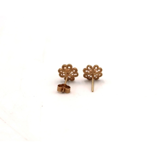 106 - A pair of marked 9ct yellow gold and pearl stud earrings