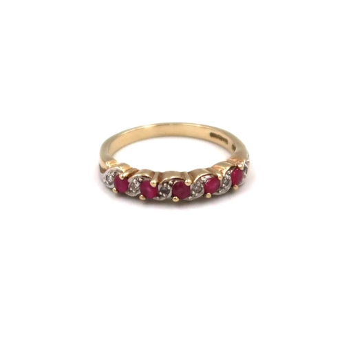 119 - A 9ct yellow gold diamond and ruby dress ring Size N, 2.7grams