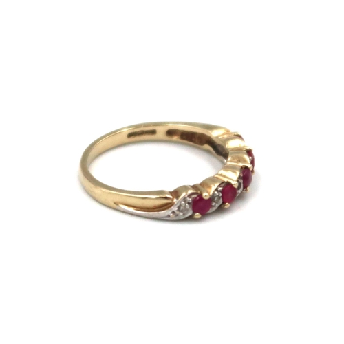 119 - A 9ct yellow gold diamond and ruby dress ring Size N, 2.7grams