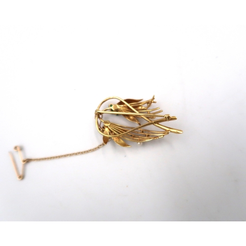 123 - A marked 18ct yellow gold and diamond brooch, 7.2grams