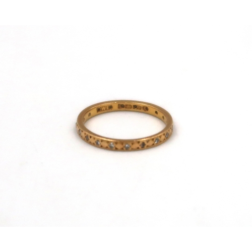 127 - A 22ct yellow gold and diamond eternity ring 2.6 grams, size J/K.