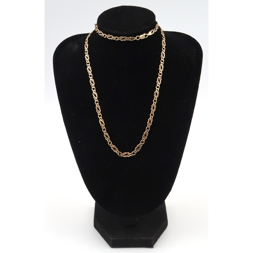 13 - A 9ct fancy link chain, 11.53 grams length 57cm