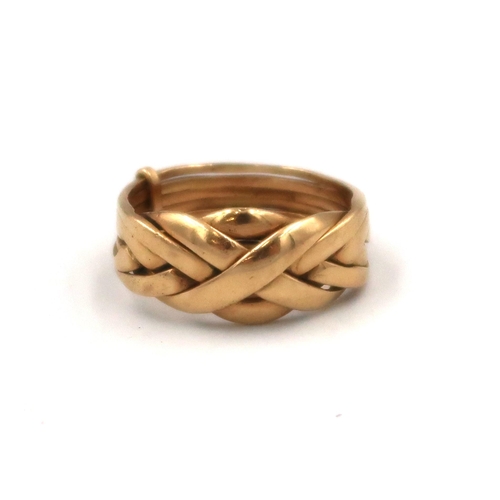 135 - An 18ct yellow gold puzzle ring, size X, 12.2grams