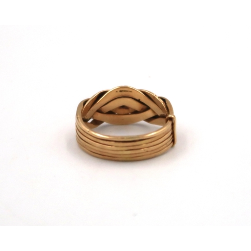 135 - An 18ct yellow gold puzzle ring, size X, 12.2grams