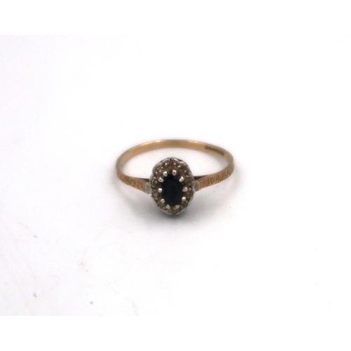 A 9ct yellow gold sapphire and diamond dress ring, Size M, 1.1grams.