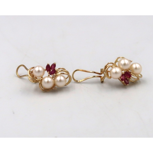 143 - A pair of cultured pearl, ruby and diamond cluster earrings. Stamped 14K. Weight  6.73grams