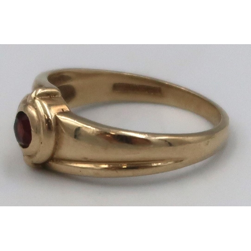 149 - A 9ct hallmarked yellow gold garnet dress ring  - size O - approx weight 2.1grams