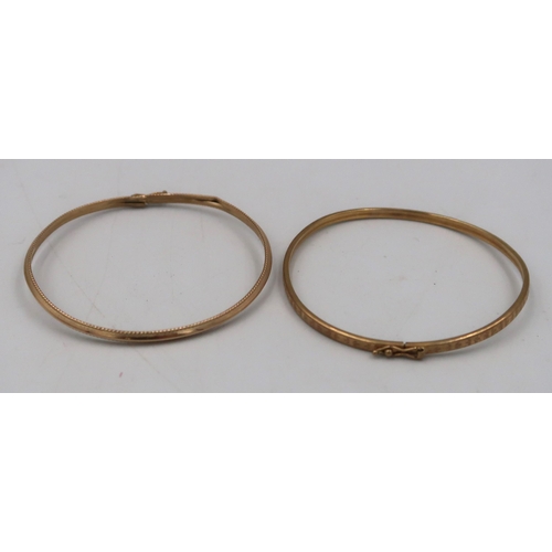 156 - Two 9ct gold bangles 6.6grams.