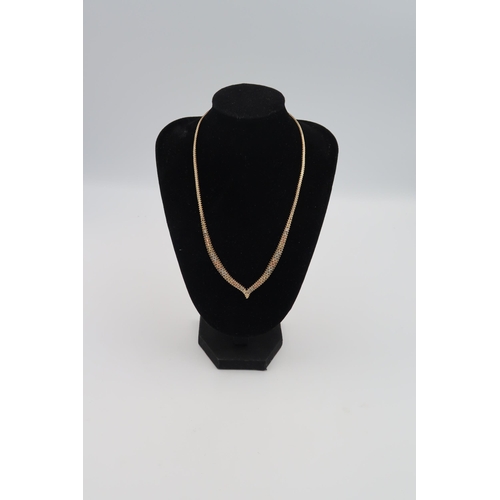 23 - A 9ct tri coloured gold necklace and matching bracelet 22.5grams.