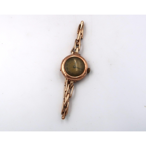 266 - A ladies marked 9ct rose gold cased wristwatch on a 9ct gold bracelet strap, 21.9grams, roman numera... 