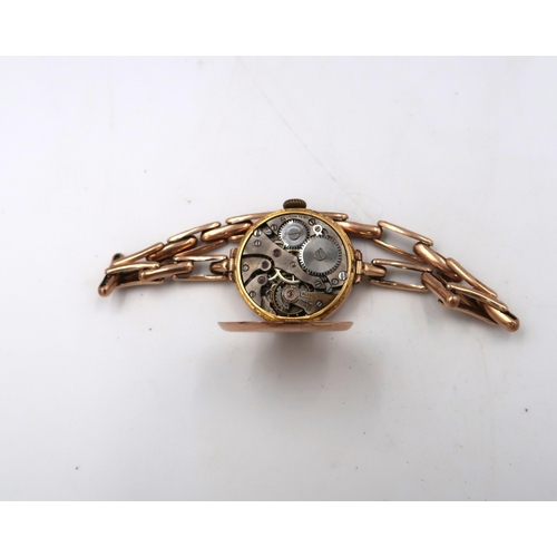 266 - A ladies marked 9ct rose gold cased wristwatch on a 9ct gold bracelet strap, 21.9grams, roman numera... 