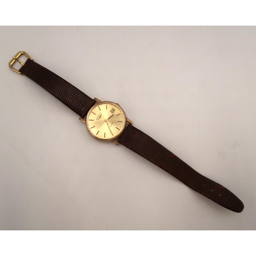 270 - A 9ct yellow gold Rotary wristwatch, baton markers with date aperture at 3 o clock, champagne colour... 