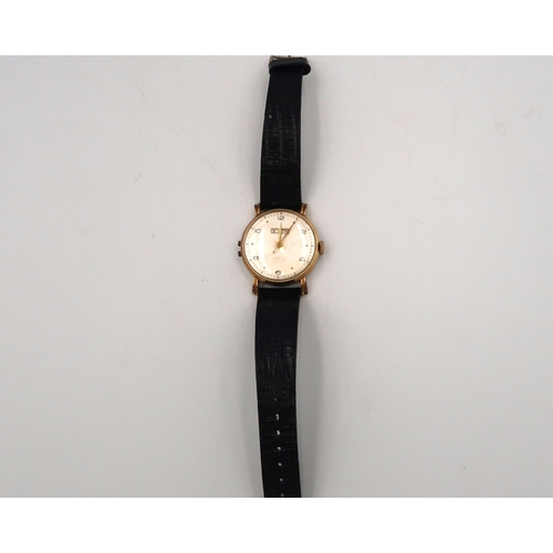 283 - An unmarked Gents wristwatch, case diameter approx 3cm, day and date aperture at 12 0 clock, running... 