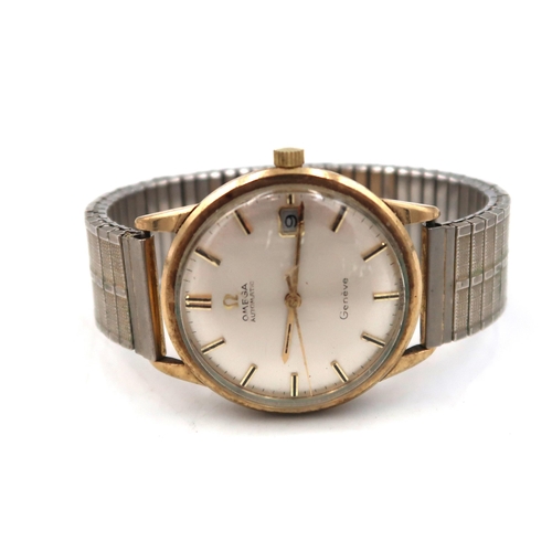 288 - A 9ct gold cased Omega Geneve Automatic Gents wristwatch, Baton markers to silvered dial 3cm across ... 