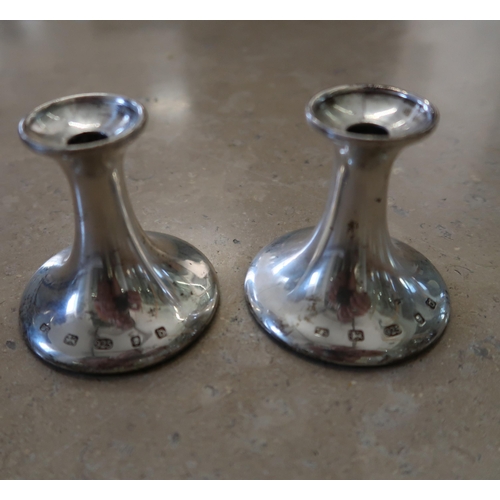 349 - A pair of hallmarked silver candlesticks, 6.5cm high