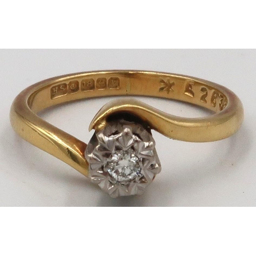 37 - An 18ct gold illusion set brilliant cut solitaire diamond crossover ring, Size J, Weight 3.25 grams.