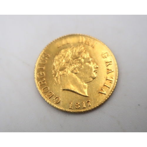 379 - A George III 1817 shield back half sovereign