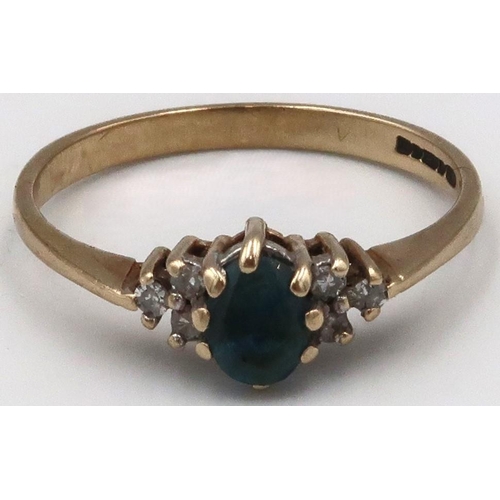 40 - A 9ct gold blue gem believed to be topaz, and diamond dress ring. Size N. Weight 1.65 grams.