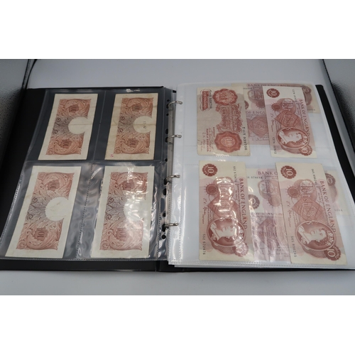 402 - An album containing Seventy seven pages of World banknotes including £1 and £5 examples in consecuti... 