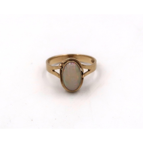 42 - A stamped 9ct yellow gold cameo ring size L, and a stamped 10K oval opal ring, size N, 4.6grams.