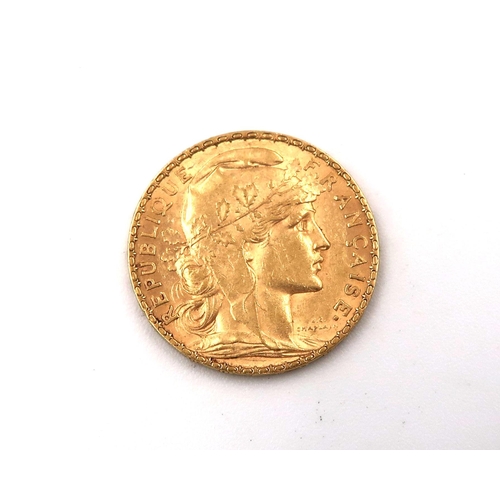 423 - A 1900 20 Franc gold coin, approx 6.5grams