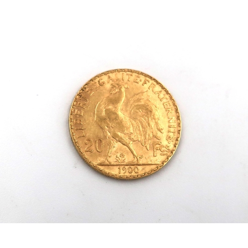 423 - A 1900 20 Franc gold coin, approx 6.5grams