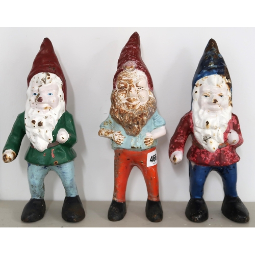 466 - Three cast iron garden Gnomes each one 29cm high