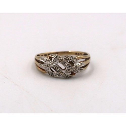 49 - A 9ct stamped yellow and white gold dress ring, Size O, 2.2grams