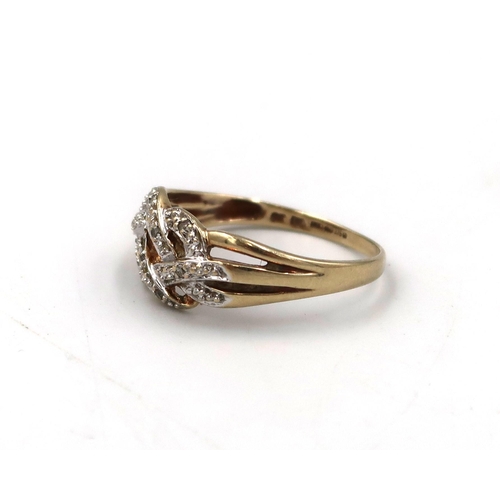 49 - A 9ct stamped yellow and white gold dress ring, Size O, 2.2grams