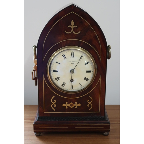 619 - A mahogany case with brass inlay, 8 day gothic style mantle clock