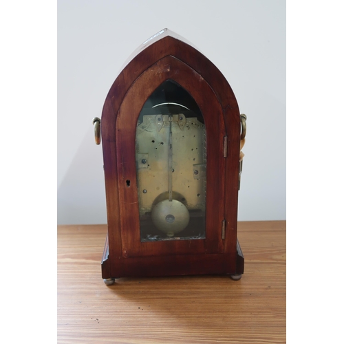 619 - A mahogany case with brass inlay, 8 day gothic style mantle clock