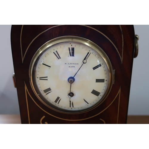 619 - A mahogany case with brass inlay, 8 day gothic style mantle clock