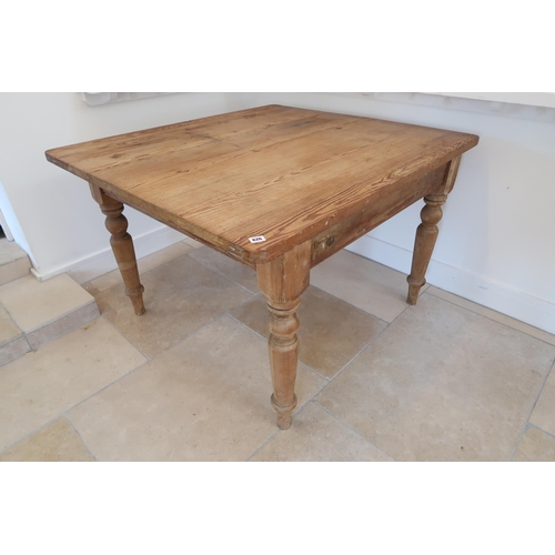 626 - A pitch pine dining table, 120cm x 100cm