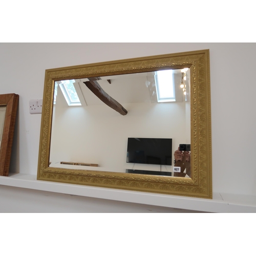 627 - A good quality wooden framed bevelled mirror, 92cm x 67cm