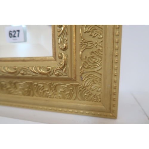 627 - A good quality wooden framed bevelled mirror, 92cm x 67cm