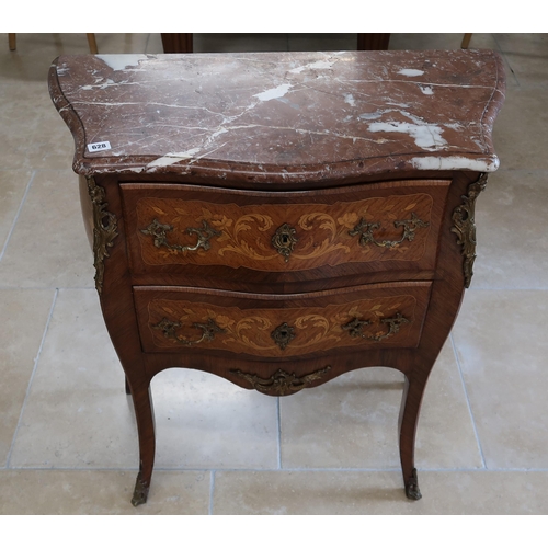 628 - A French Louis XV style, marquetry inlaid commode chest of two long drawers raised on sabre supports... 