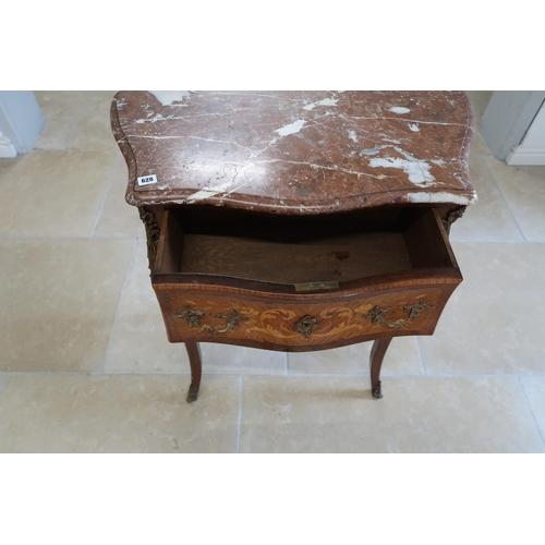 628 - A French Louis XV style, marquetry inlaid commode chest of two long drawers raised on sabre supports... 