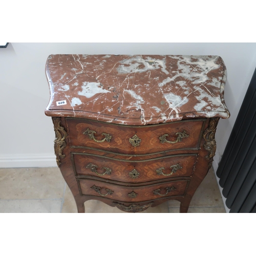 629 - A French Louis XV style, marquetry inlaid commode chest of three long drawers raised on sabre suppor... 