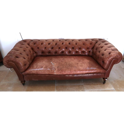 639 - A 19th century Howard style country house large button back Chesterfield settee with a nice faded pa... 