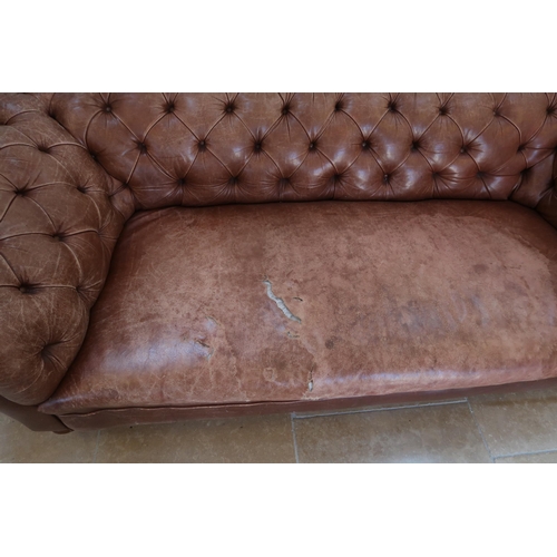 639 - A 19th century Howard style country house large button back Chesterfield settee with a nice faded pa... 