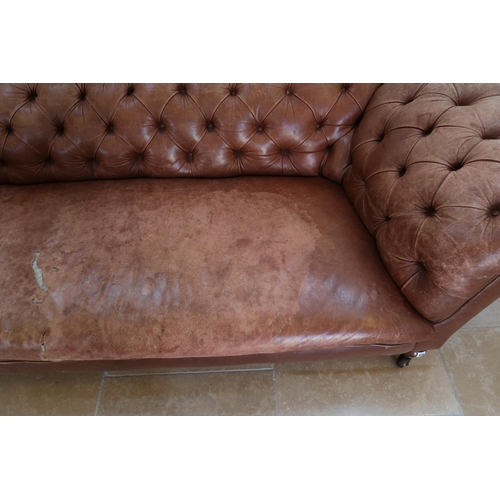 639 - A 19th century Howard style country house large button back Chesterfield settee with a nice faded pa... 