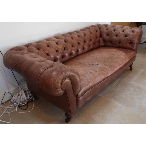 639 - A 19th century Howard style country house large button back Chesterfield settee with a nice faded pa... 