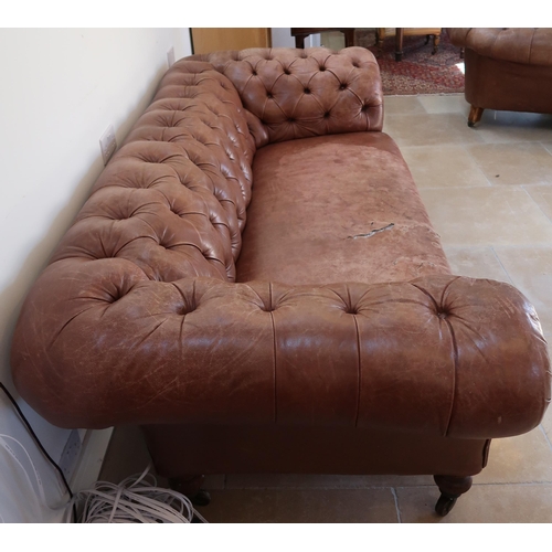 639 - A 19th century Howard style country house large button back Chesterfield settee with a nice faded pa... 