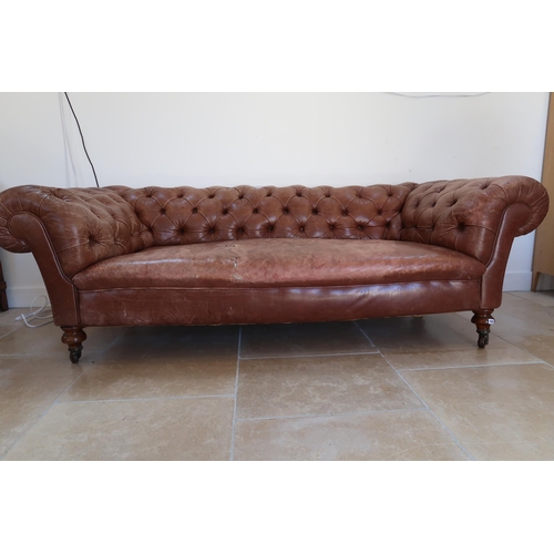 639 - A 19th century Howard style country house large button back Chesterfield settee with a nice faded pa... 