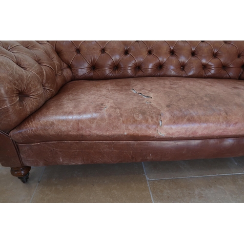 639 - A 19th century Howard style country house large button back Chesterfield settee with a nice faded pa... 