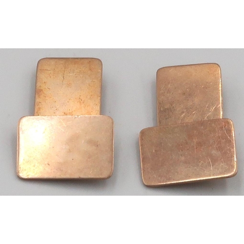 64 - A pair of cufflinks, stamped 10K, weight 8.91 grams.