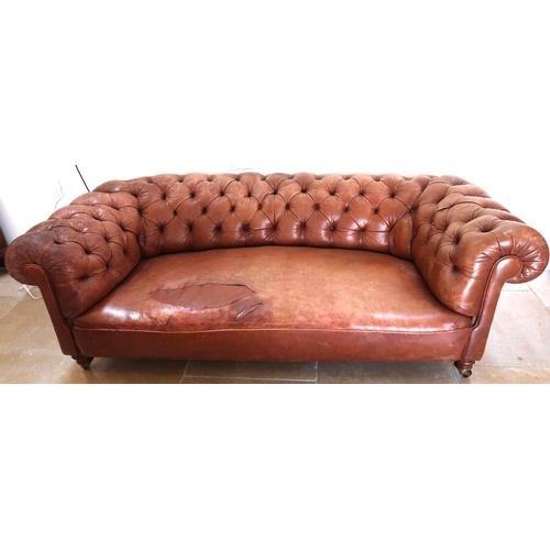 640 - A 19th century Howard style country house large button back Chesterfield settee with a nice faded pa... 